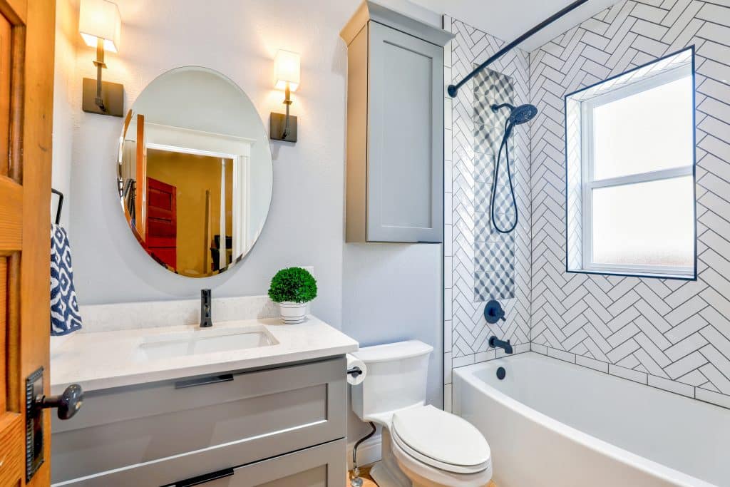 oval-mirror-near-toilet-bowl-1910472